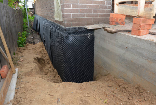 Happy homeowners after waterproofing job in McBain